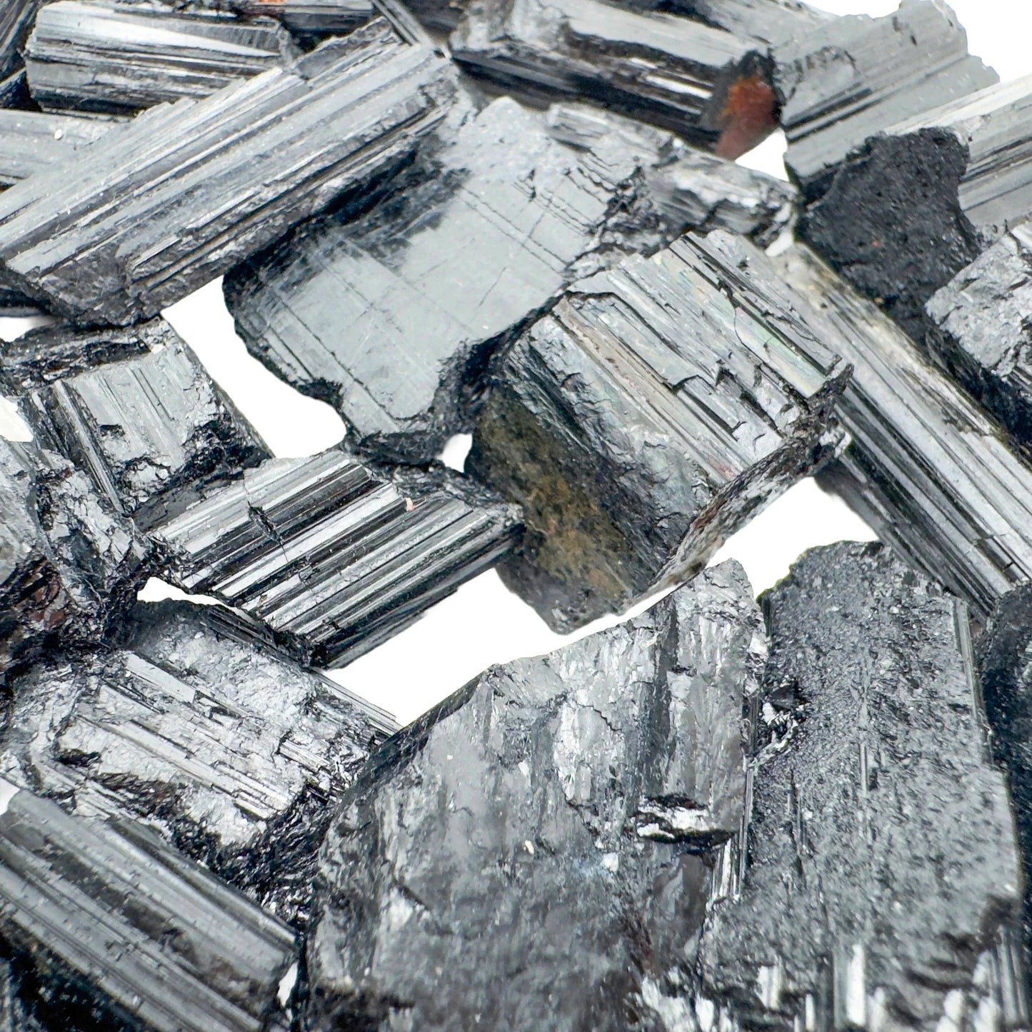 Alternate angle of Grade AA Black Tourmaline raw showing overall shape