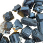 Overhead view of Black Tourmaline raw stone, showing tight grain, turned to for Protection and Grounding.