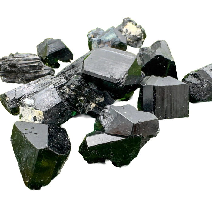 Size comparison with one Black Tourmaline raw stone for scale, from Namibia.