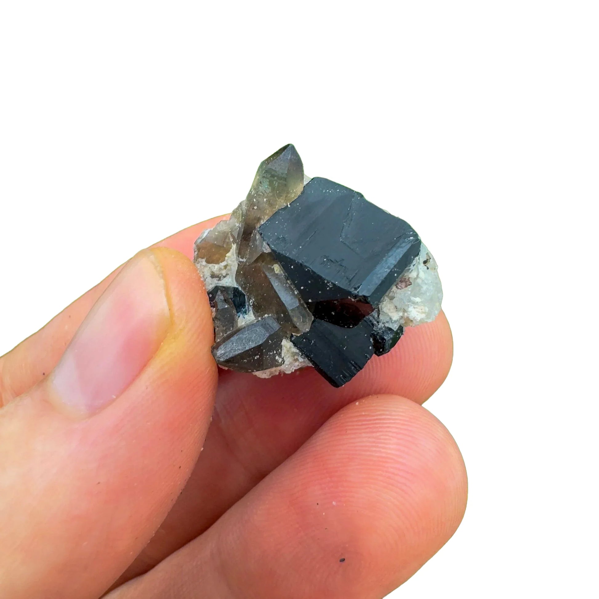 Grade aa black tourmaline raw held in hand for size reference