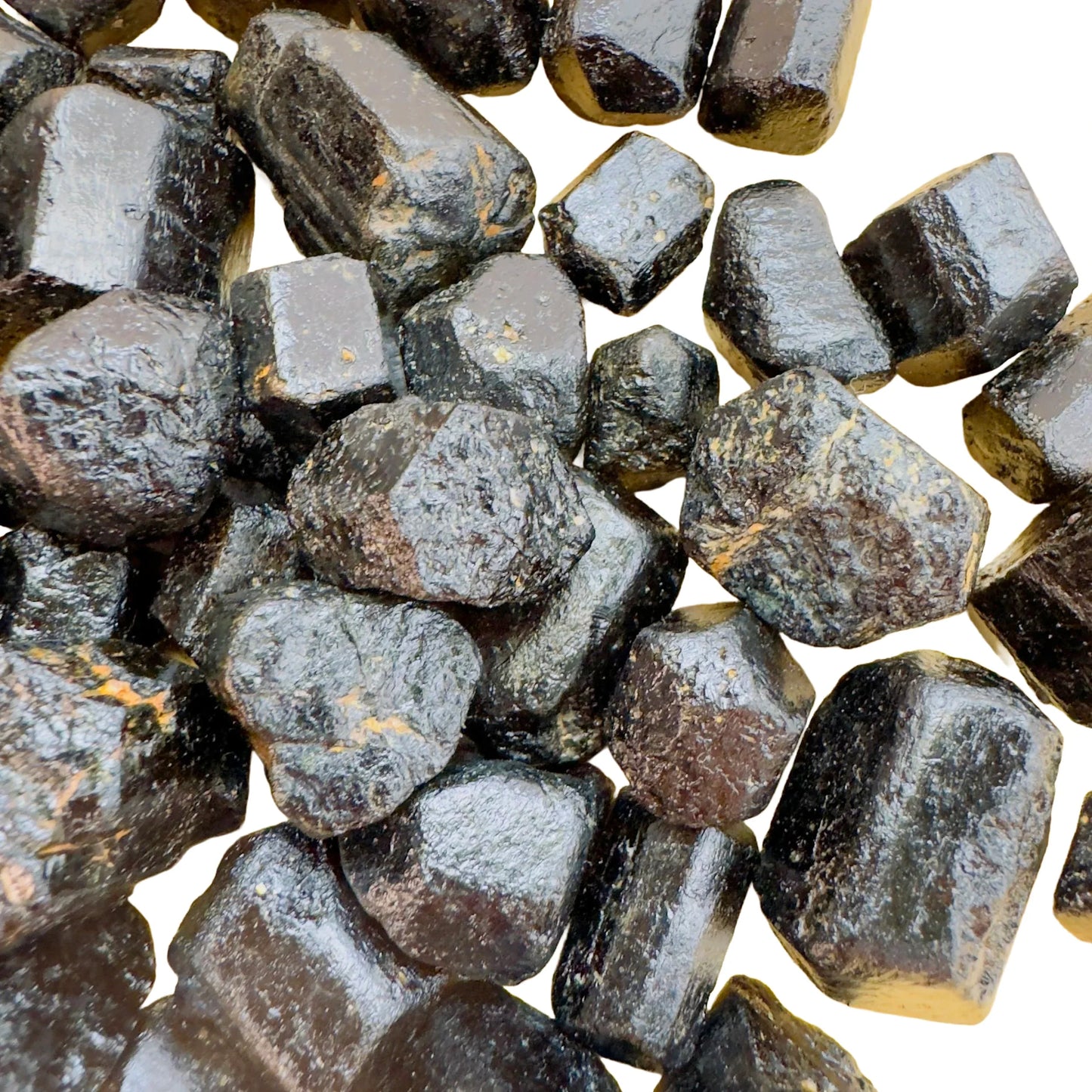 Top-down shot of Grade A Black Tourmaline raw stone, showing characteristic finish, drawn on for Protection.