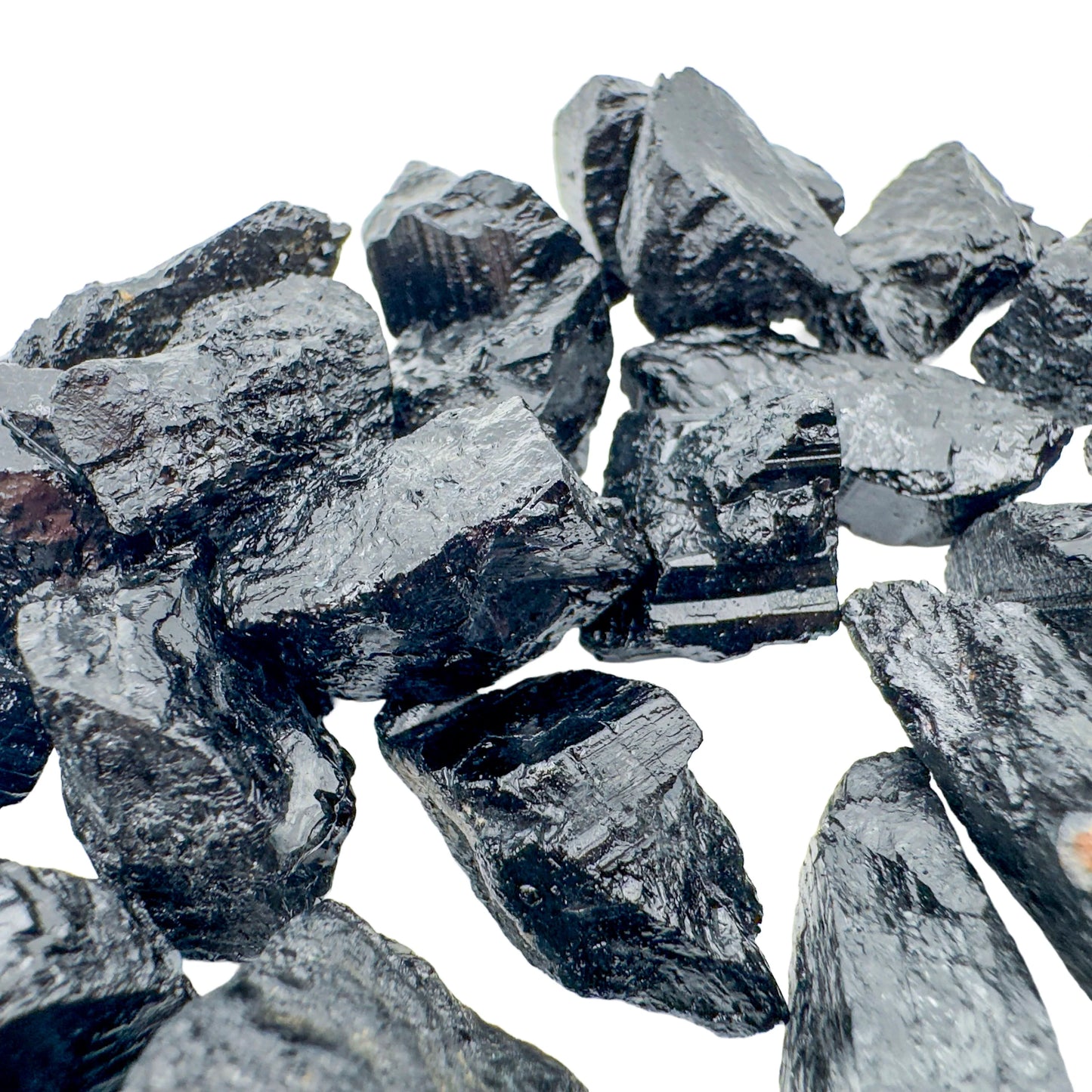 Resting display of Black Tourmaline raw crystal, from Minas Gerais, Brazil, captured in natural daylight.