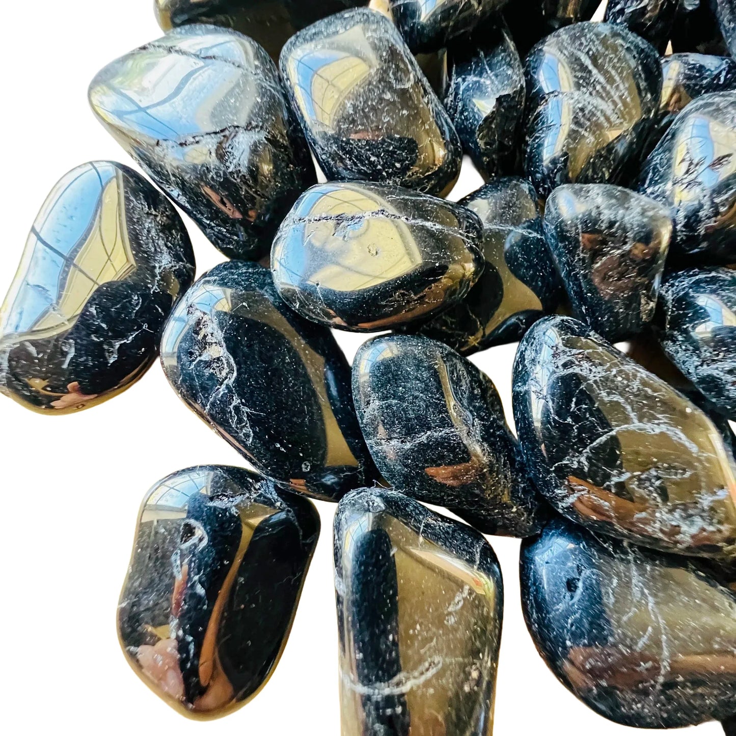 Natural surface of Black Tourmaline tumbled stone, kept close for Protection.