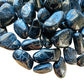 Plan view of Black Tourmaline tumbled stone, showing matte finish, from Minas Gerais, Brazil.
