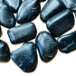Close-up of Grade AA Black Tourmaline tumbled stone, sourced from Minas Gerais, Brazil, showing characteristic finish.