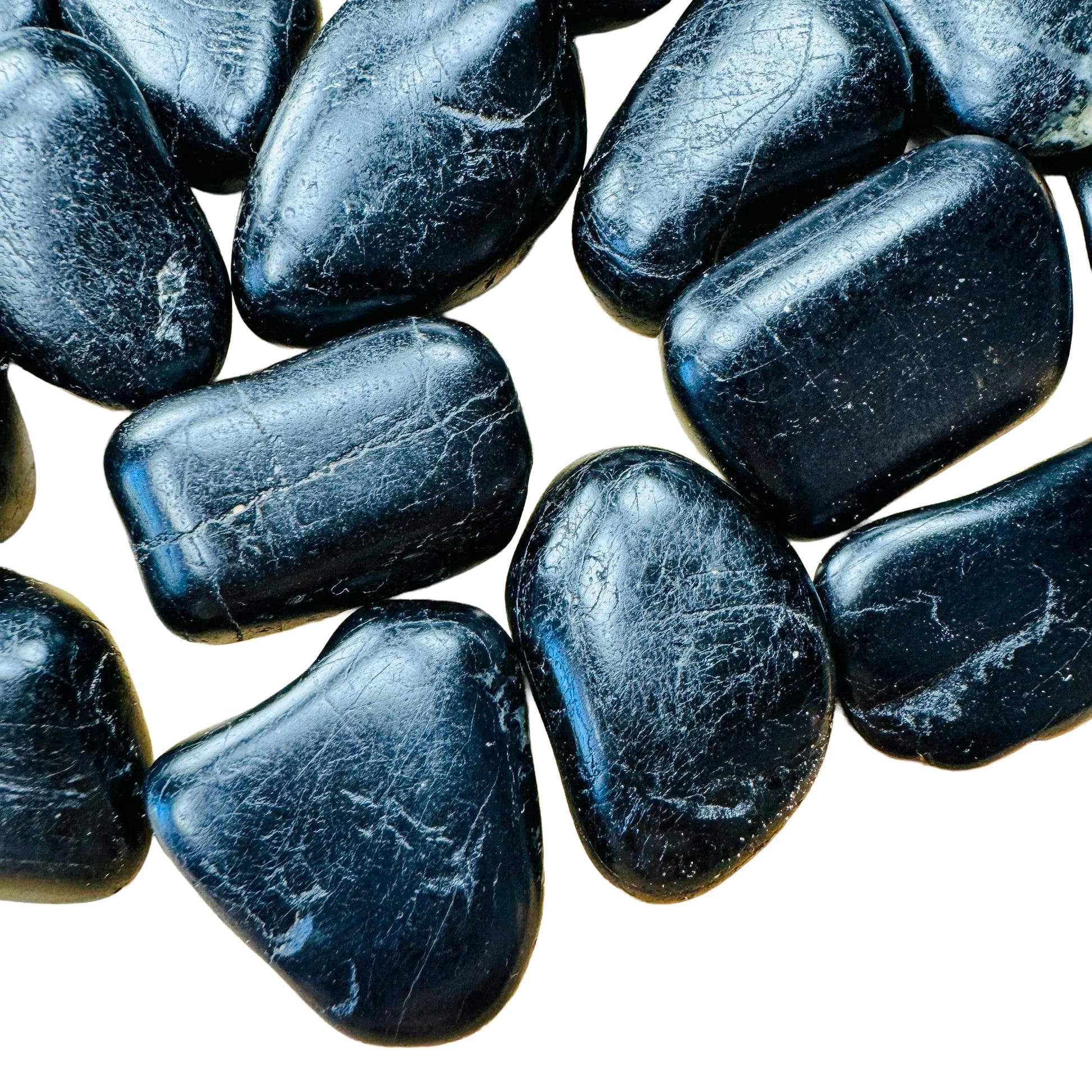 Close-up of Grade AA Black Tourmaline tumbled stone, sourced from Minas Gerais, Brazil, showing characteristic finish.
