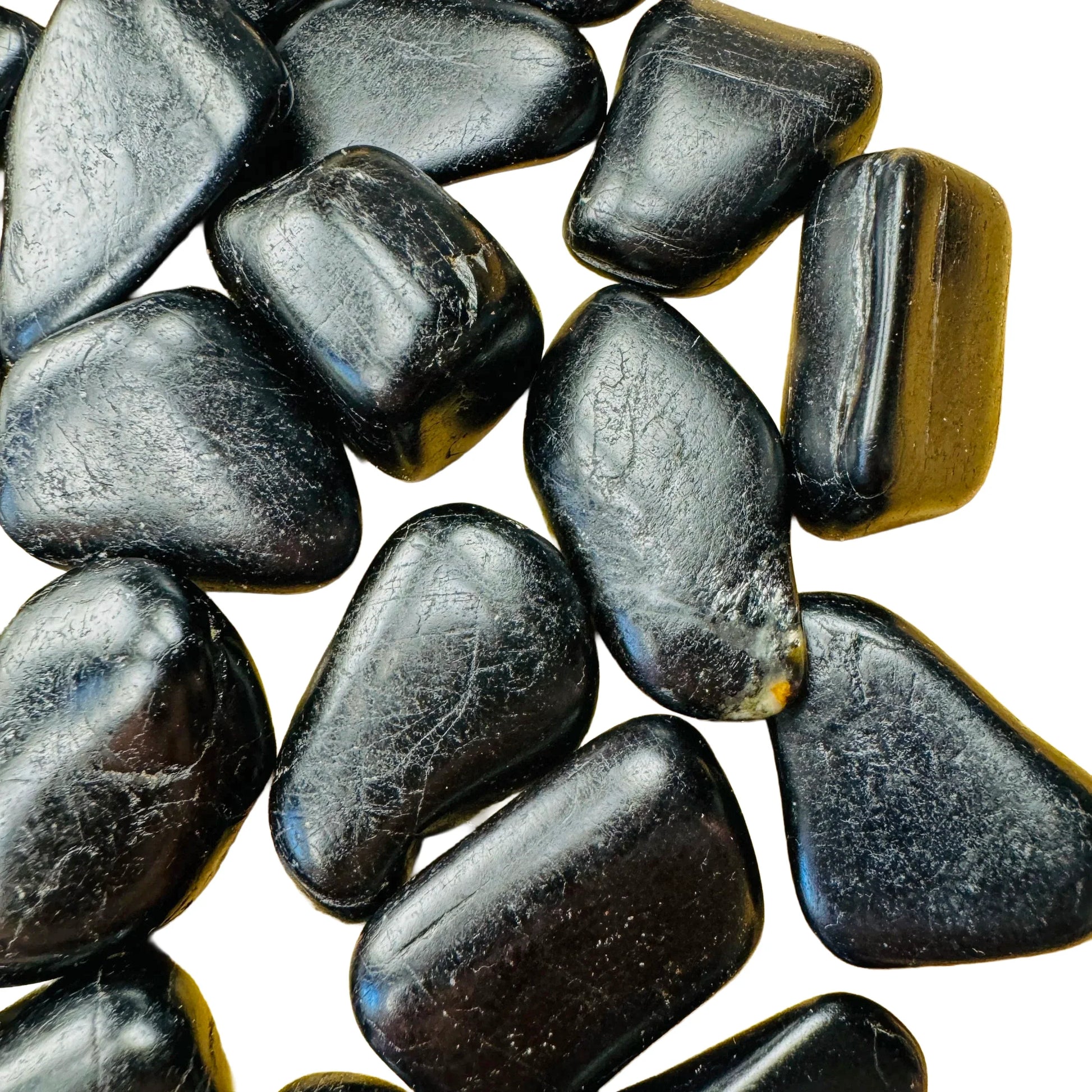 Top-side view of Black Tourmaline tumbled stone, turned to for Protection and Grounding, showing color depth.