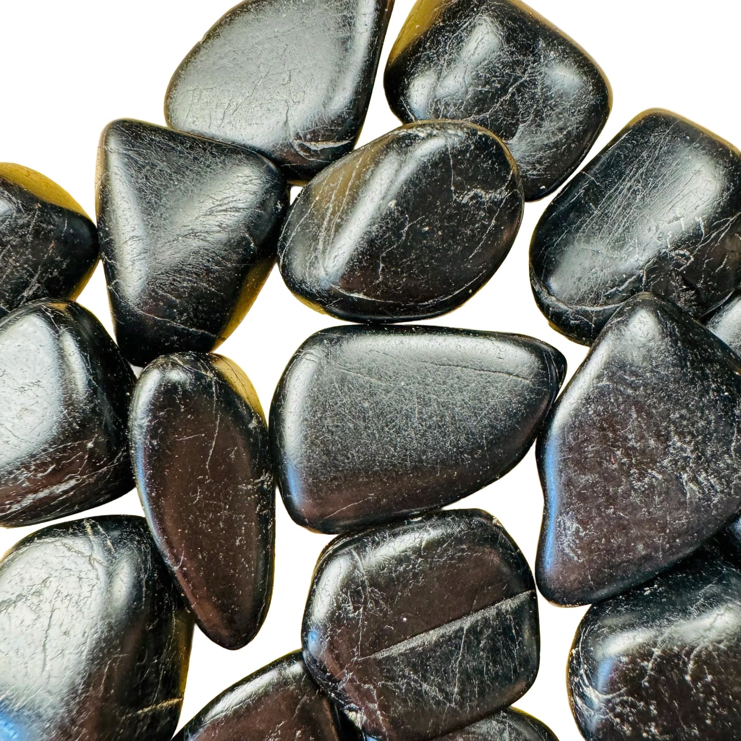 Reverse angle of Grade AA Black Tourmaline tumbled stone, showing earthy tone, linked to Protection and Grounding.