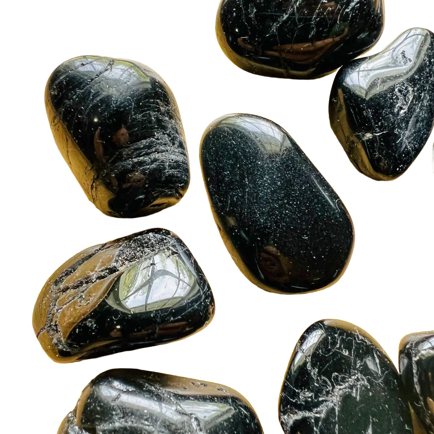 Back view of Grade AA Black Tourmaline tumbled stone showing natural surface