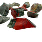 Top-down shot of Grade AA Bloodstone raw stone, from Eswatini, showing tight grain.