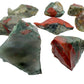 Held in hand, a Bloodstone raw stone, from Eswatini.