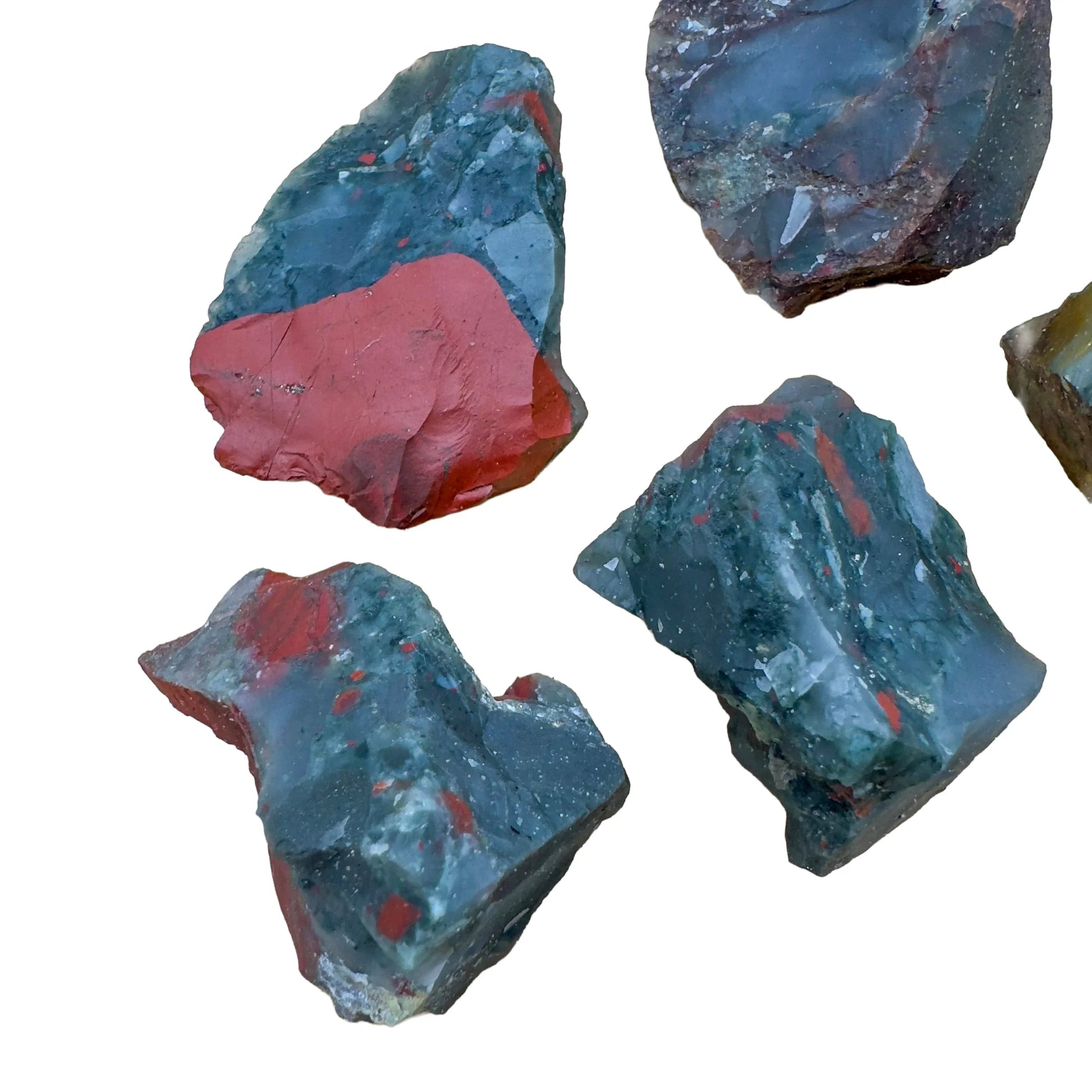 Hand-scale shot of one Bloodstone raw stone for scale, sourced from Eswatini.