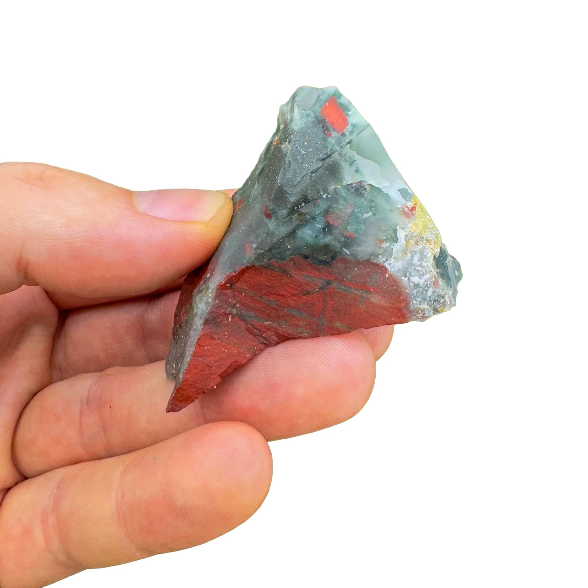 Grade aa bloodstone raw held in hand for size reference