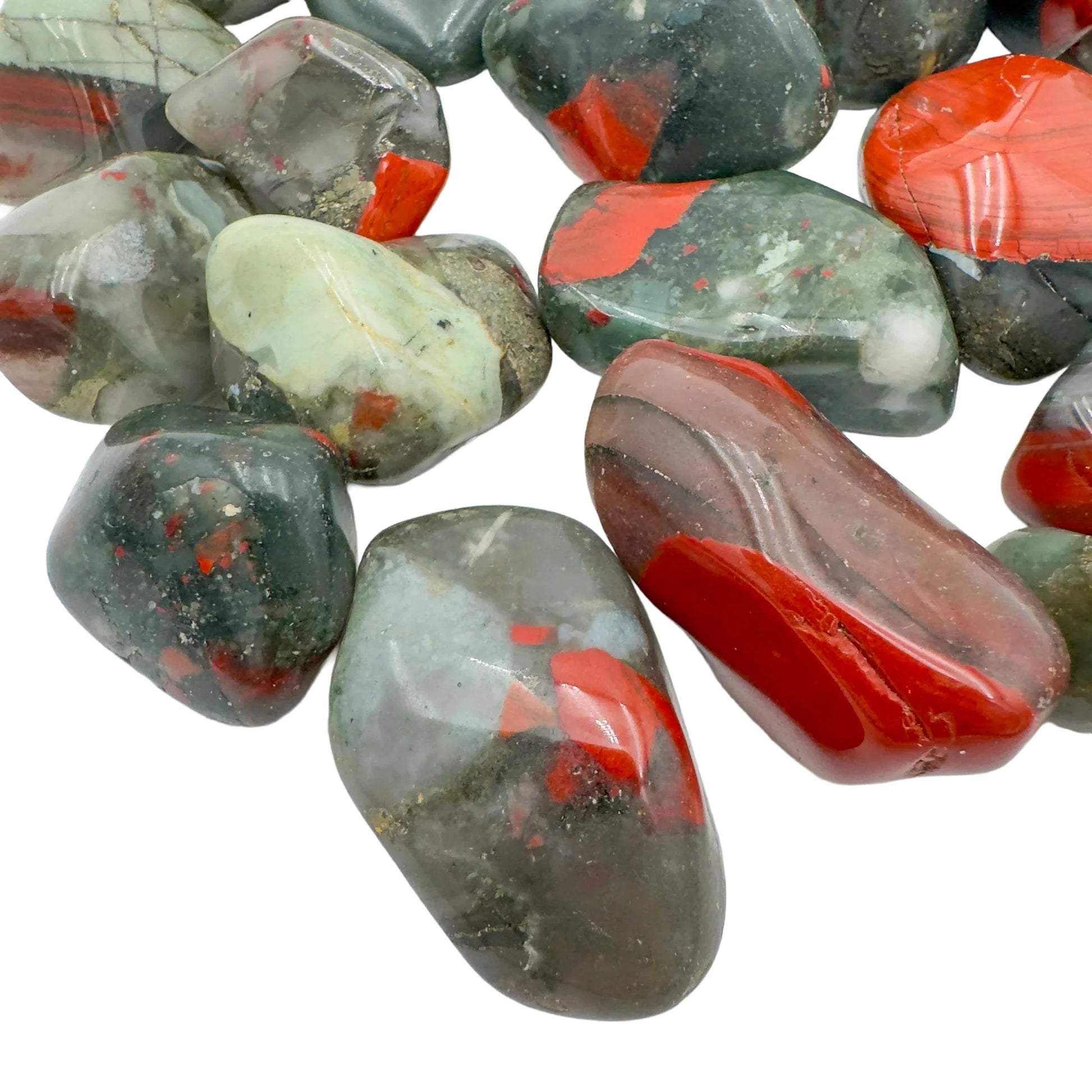 Edge-on view of Bloodstone tumbled stone, linked to Energy and Protection, showing characteristic finish.