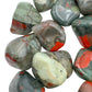 Underside detail of Grade AA Bloodstone tumbled stone, showing translucent edges.