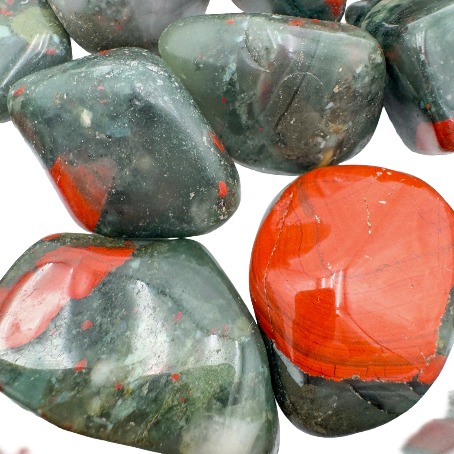 Scale reference of a single Bloodstone tumbled stone sourced from Eswatini.