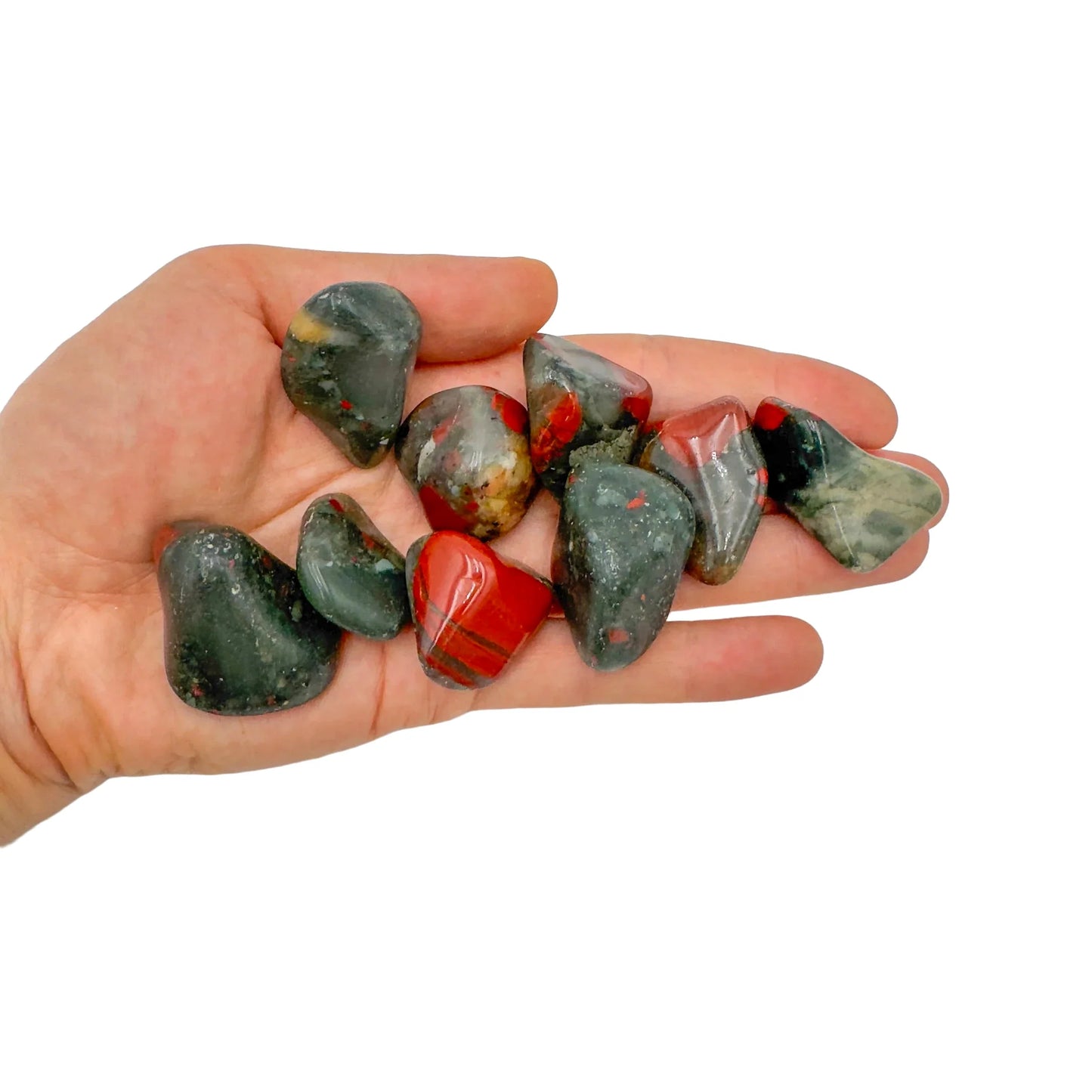 Detail shot of Grade AA Bloodstone tumbled stone under natural light