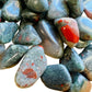 Detail of Bloodstone tumbled stone, often kept for Energy.