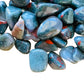 Overhead view of Grade AA Bloodstone tumbled stone, from Eswatini, showing natural variation.