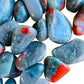 Bottom side of Bloodstone tumbled stone, showing matte finish.