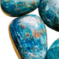 Sideways view of Apatite palm stone, showing characteristic finish.