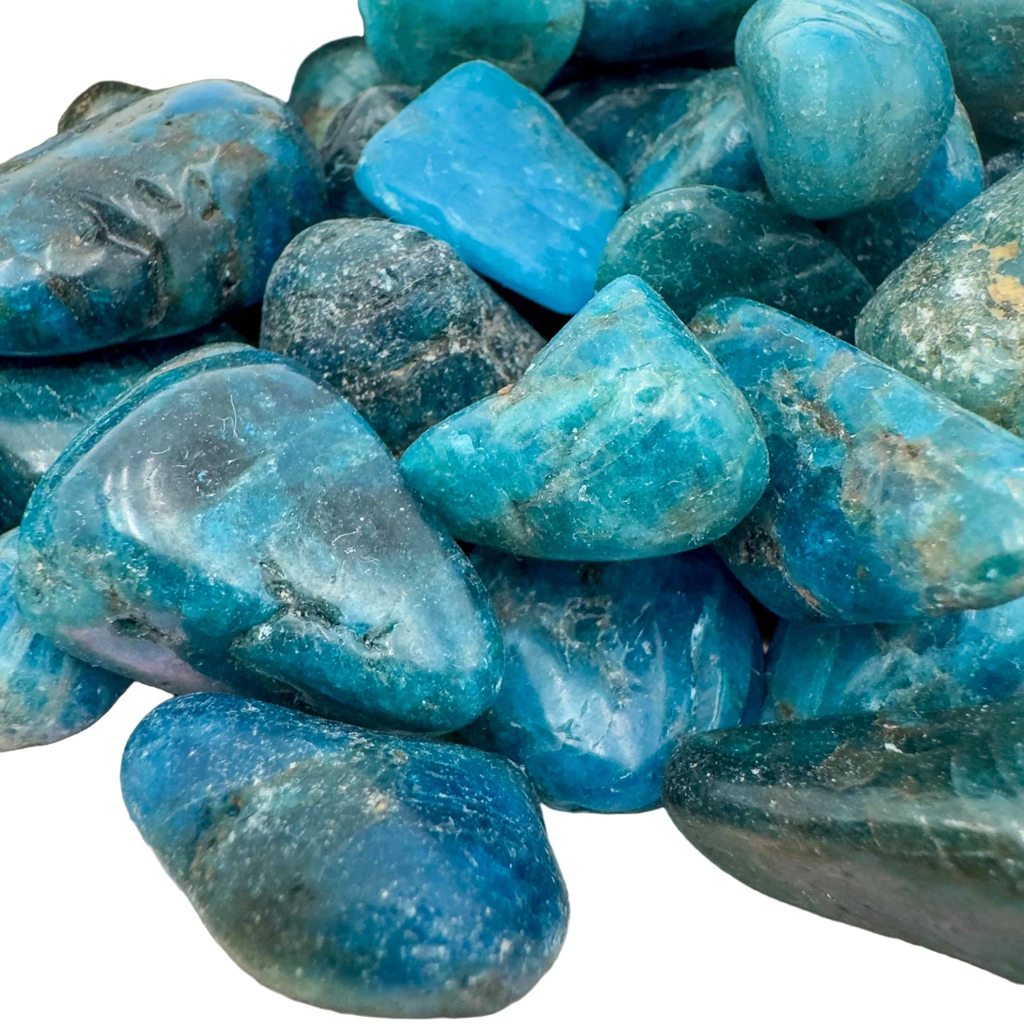 Profile view of Apatite tumbled stone, Madagascar-sourced, often kept for Focus and Manifestation.
