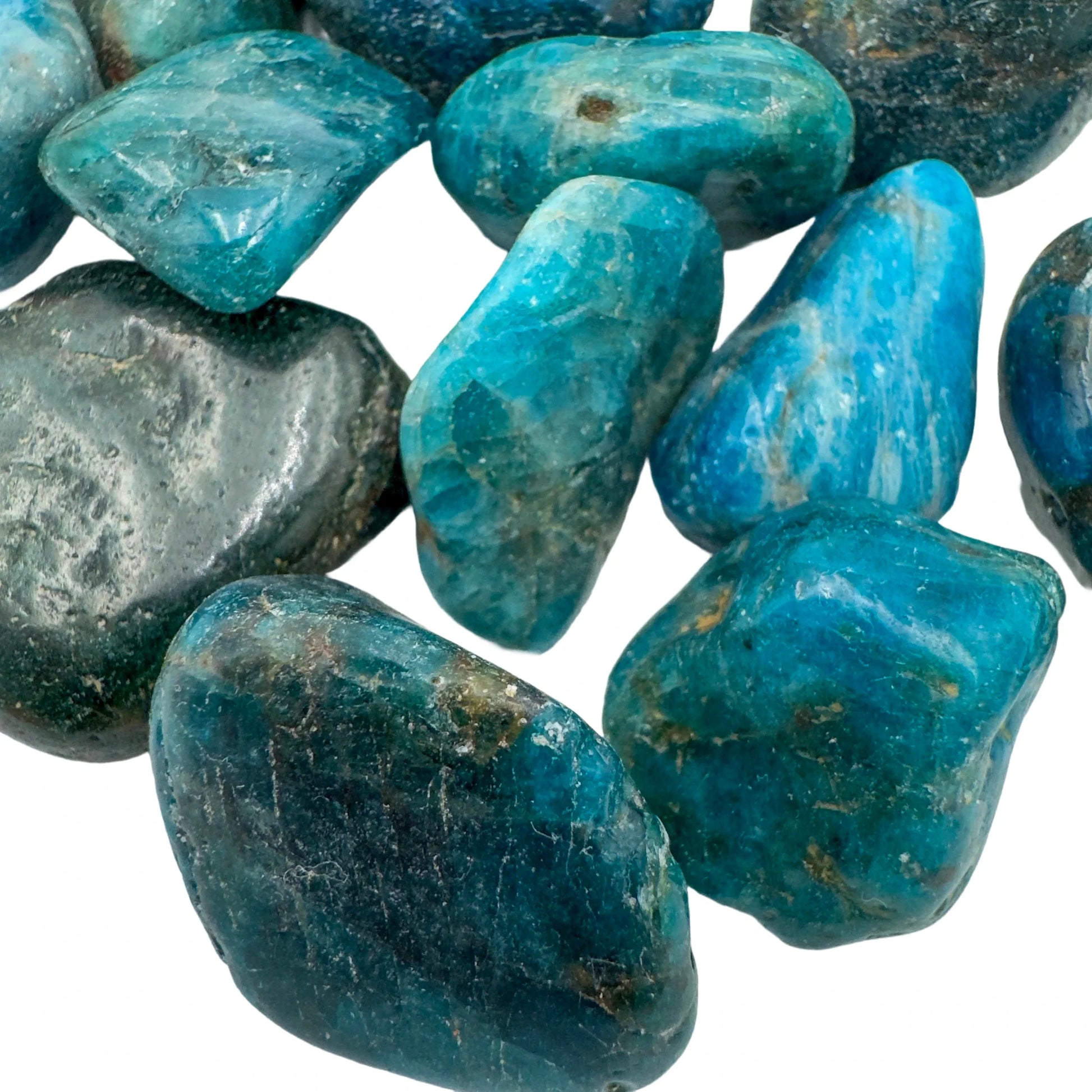 Hand-held view of a Apatite tumbled stone to support Focus, sourced from Anosy, Madagascar.