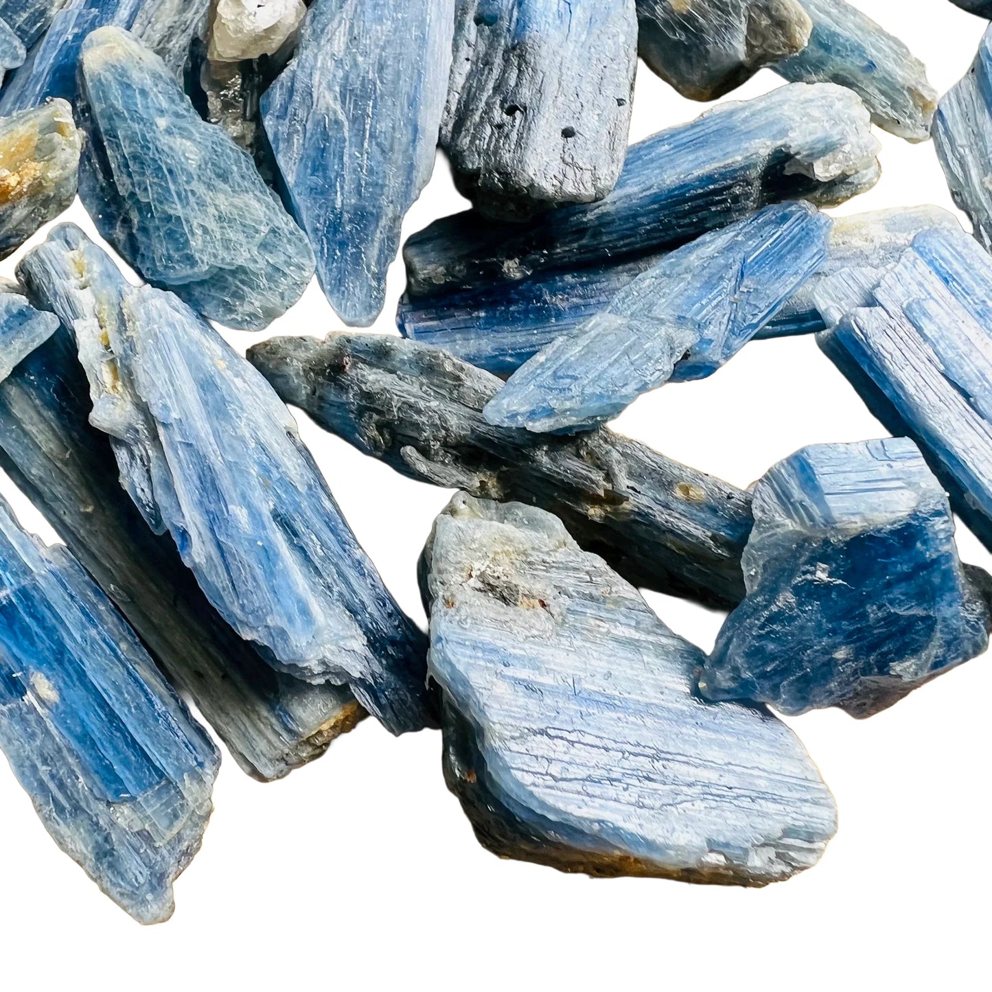 Grade aa blue kyanite raw held in hand for size reference