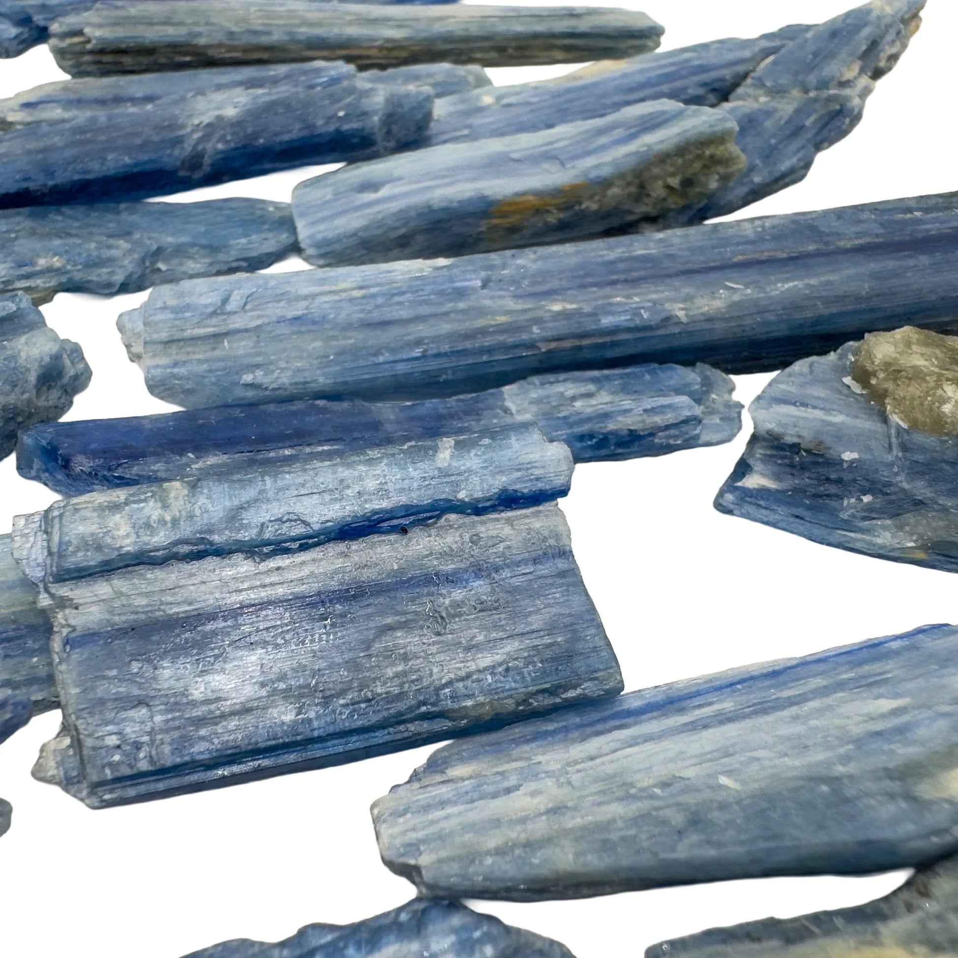 Back view of Blue Kyanite raw stone, showing characteristic patterning, carried for Confidence.