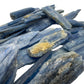 Grade aa blue kyanite raw held in hand for size reference