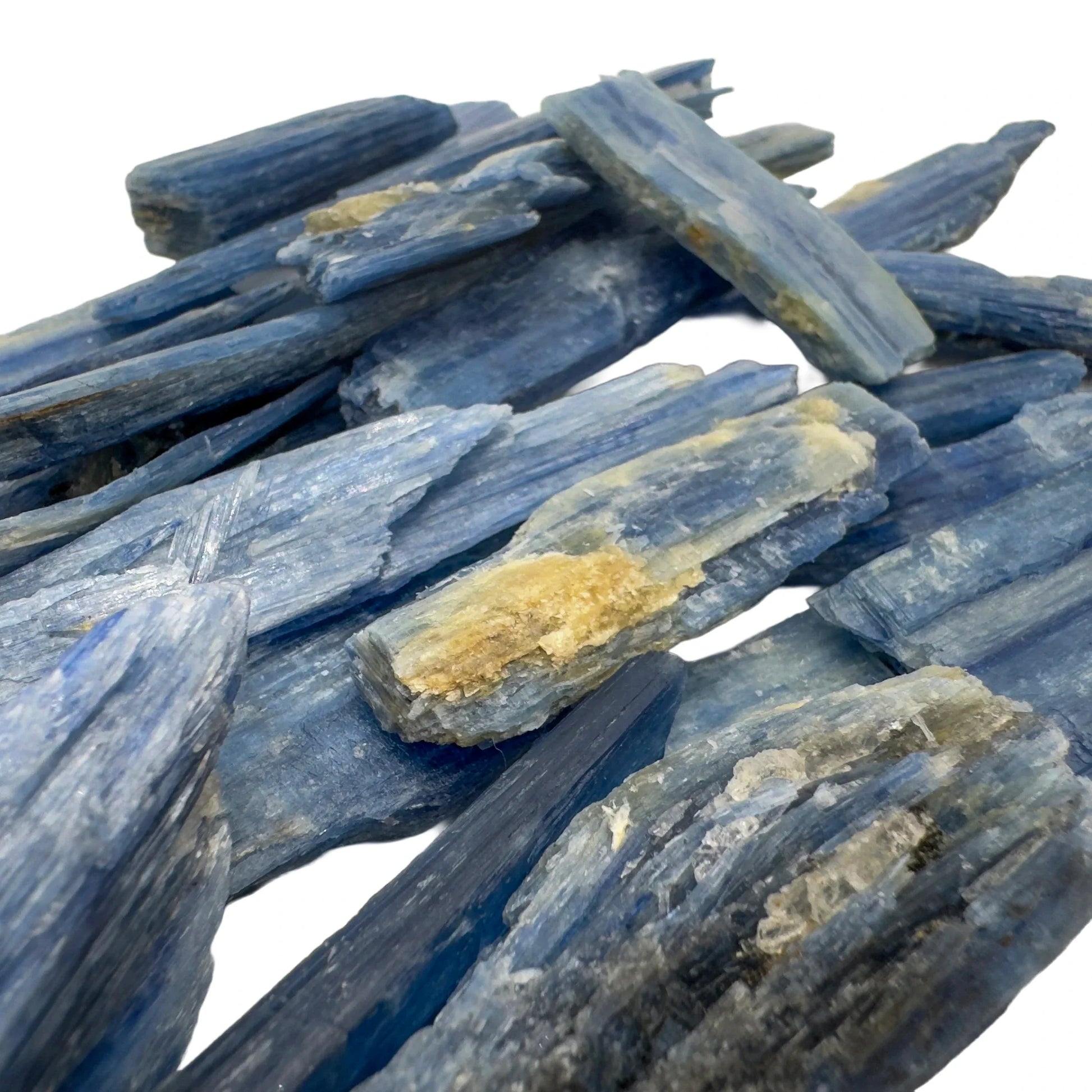 Grade aa blue kyanite raw held in hand for size reference