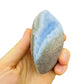 Resting display of Blue Lace Agate specimen, shown for size reference.