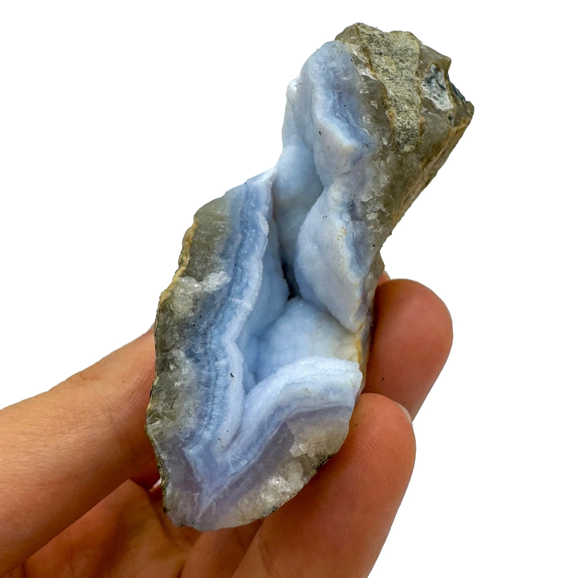 Detail shot of Grade AA Blue Lace Agate geode under natural light