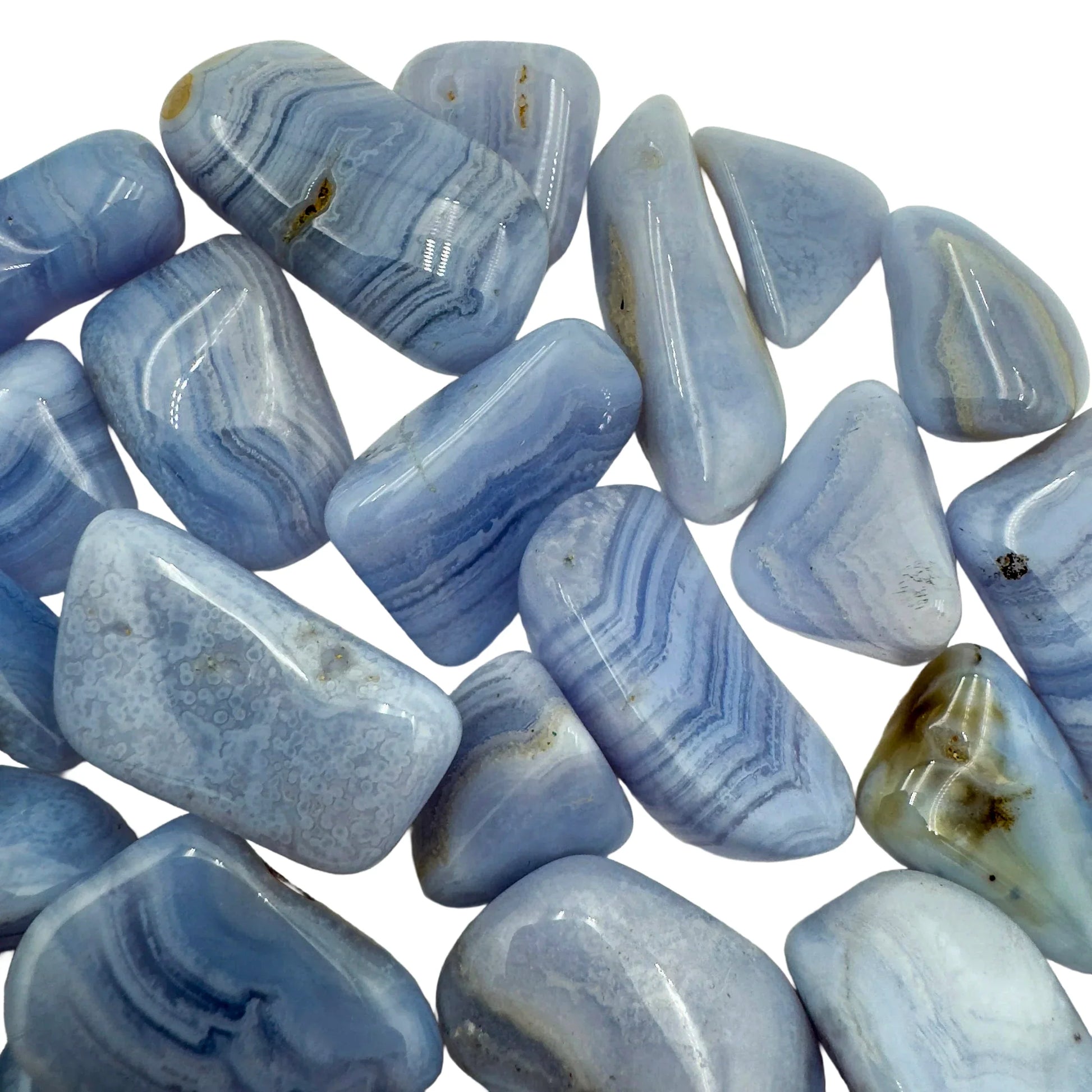 Three-quarter view of Blue Lace Agate tumbled stone, from ǁkaras Region, Namibia, with hand-sized presence.