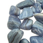 Edge-on view of Grade A Blue Lace Agate tumbled stone, from Namibia, showing characteristic color.