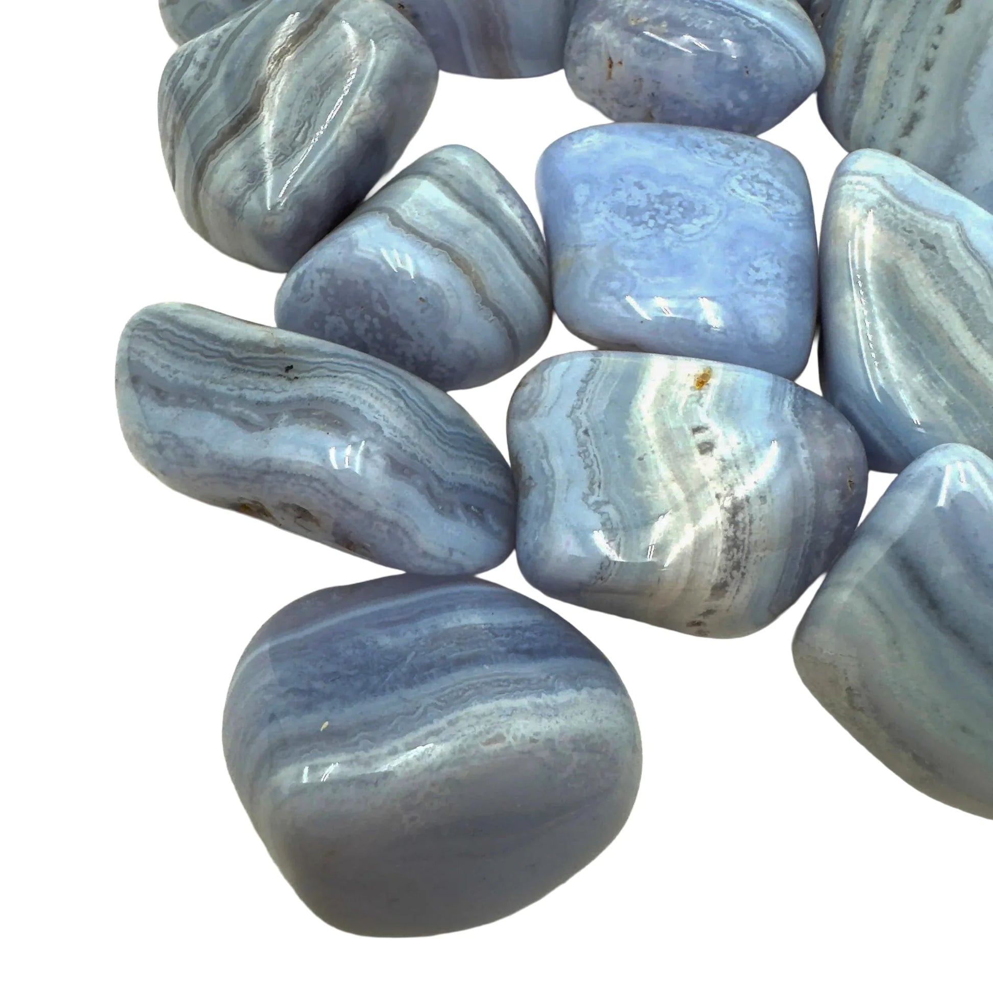 Hand-held view of a Blue Lace Agate tumbled stone, sourced from ǁKaras Region, Namibia.