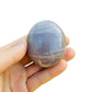 Surface detail of Grade A Blue Rose Quartz palm stone, showing matte finish.
