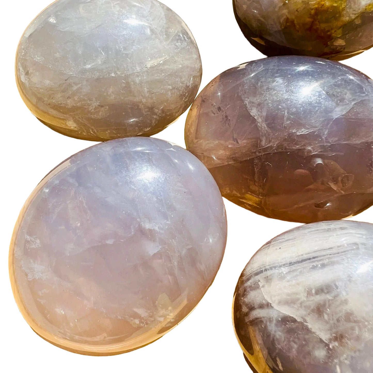 Considered view of Blue Rose Quartz palm stone, from Alaotra-Mangoro, Madagascar, traditionally used for Love, captured in soft, even lighting.