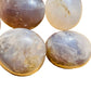 Back view of Grade A Blue Rose Quartz palm stone showing natural surface