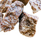Lifestyle view of one Brown Aragonite raw stone for scale, Peru-sourced, from Junín, Peru.