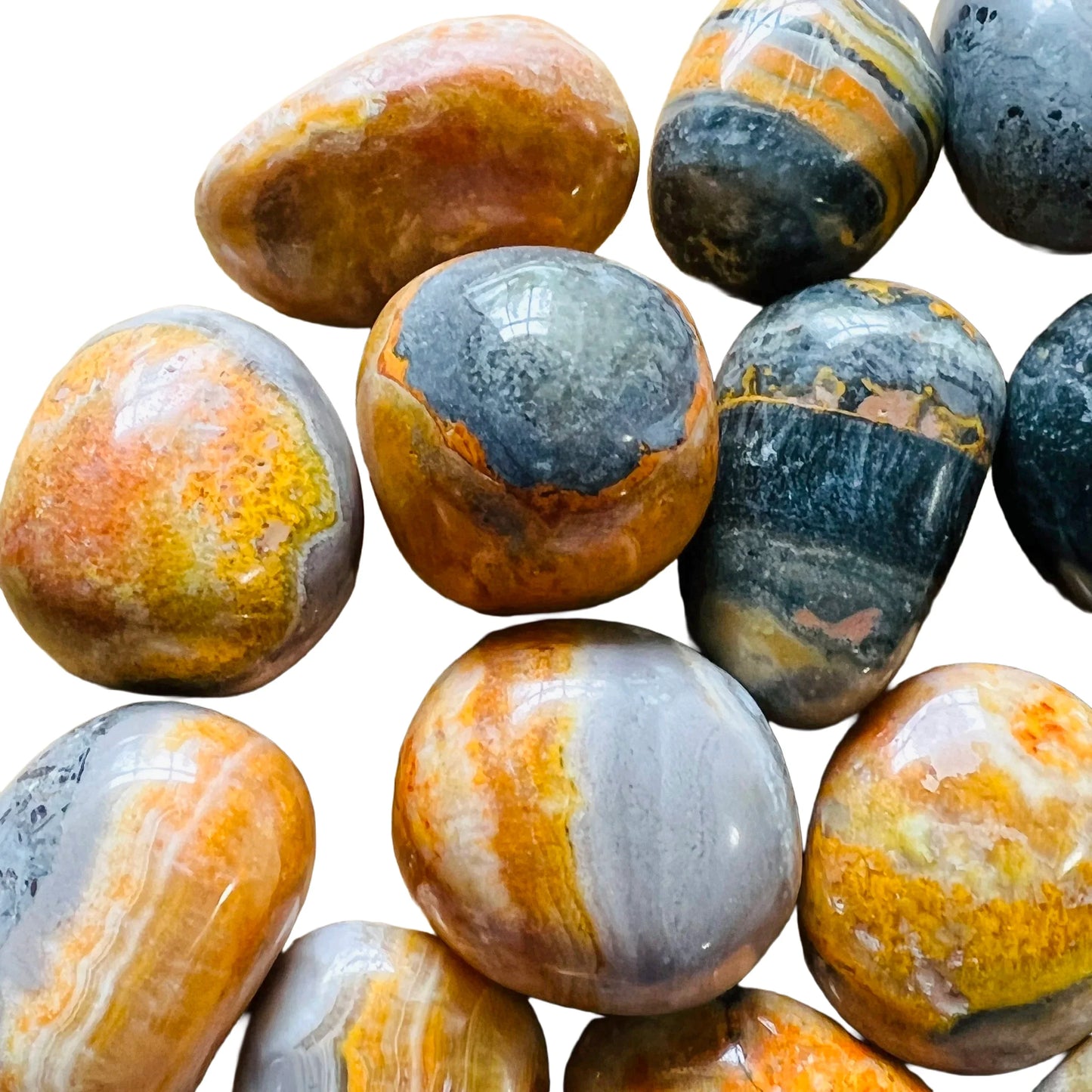 Held in palm of a Bumblebee Jasper tumbled stone, captured in soft, even lighting.