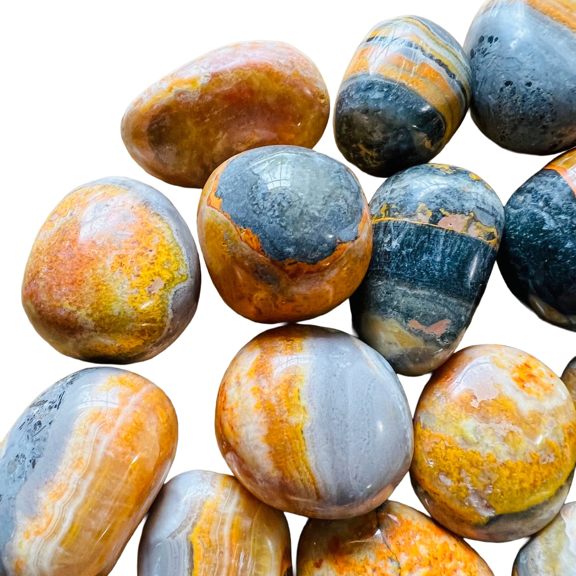 Detail shot of Grade AA Bumblebee Jasper tumbled stone under natural light
