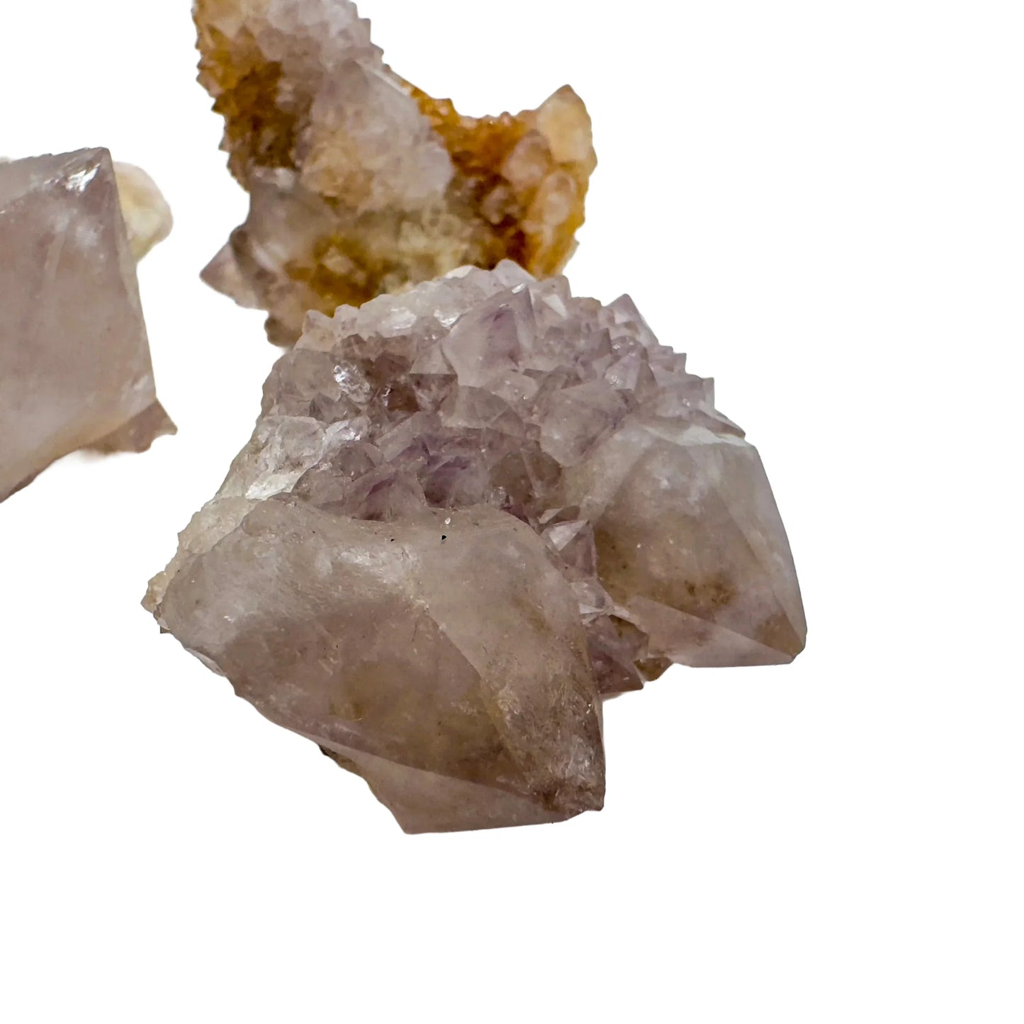 Hand-scale shot of a Quartz raw stone held against natural backdrop, South Africa-sourced.
