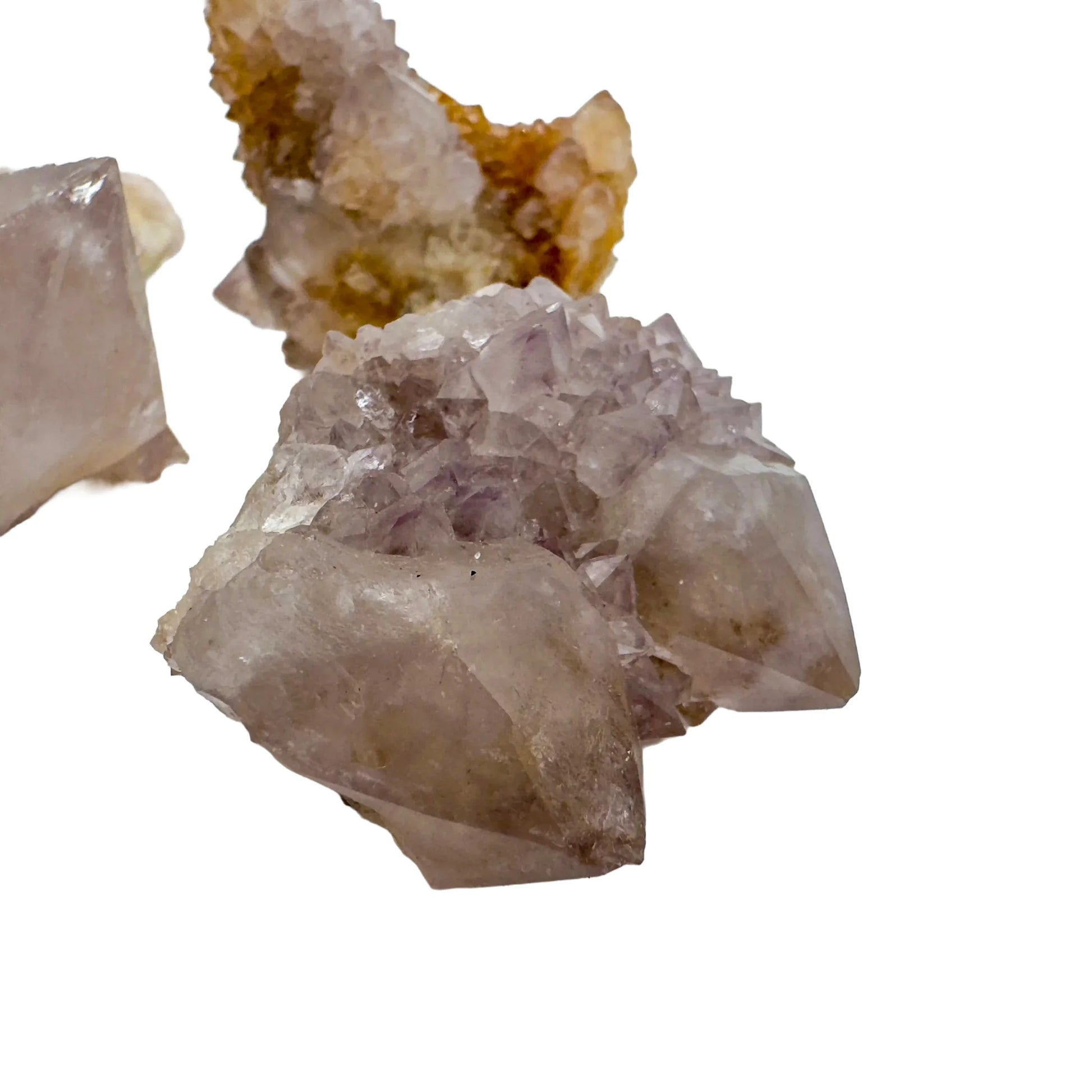 Hand-scale shot of a Quartz raw stone held against natural backdrop, South Africa-sourced.