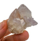 Grade aa quartz raw held in hand for size reference