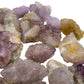 Grade aa quartz raw held in hand for size reference