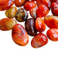 Rear view of Grade AA orange Carnelian tumbled stone, worked with for Energy, from Boeny, Madagascar.