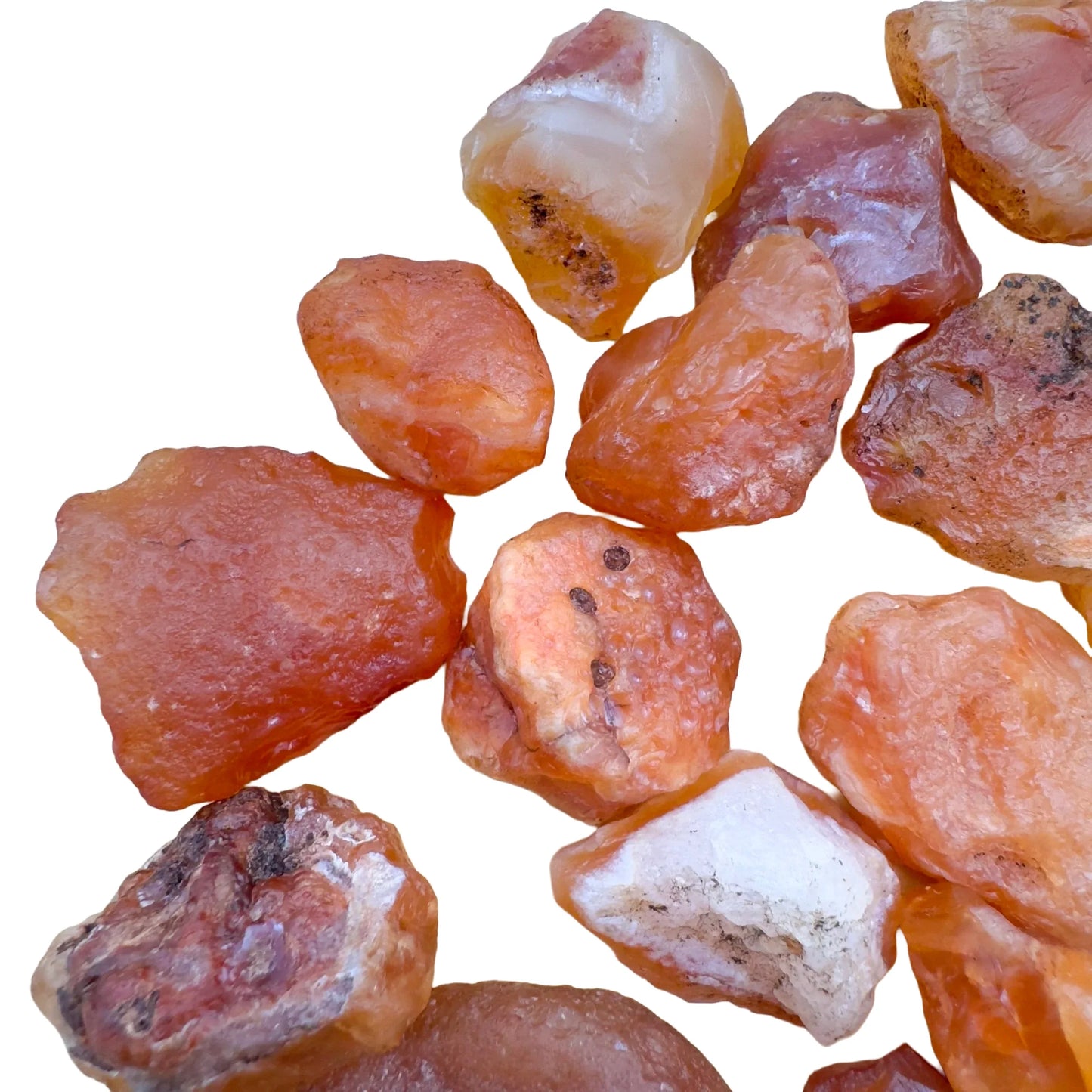 Bottom side of Grade A Carnelian raw stone, sourced from Malawi, showing natural inclusions.
