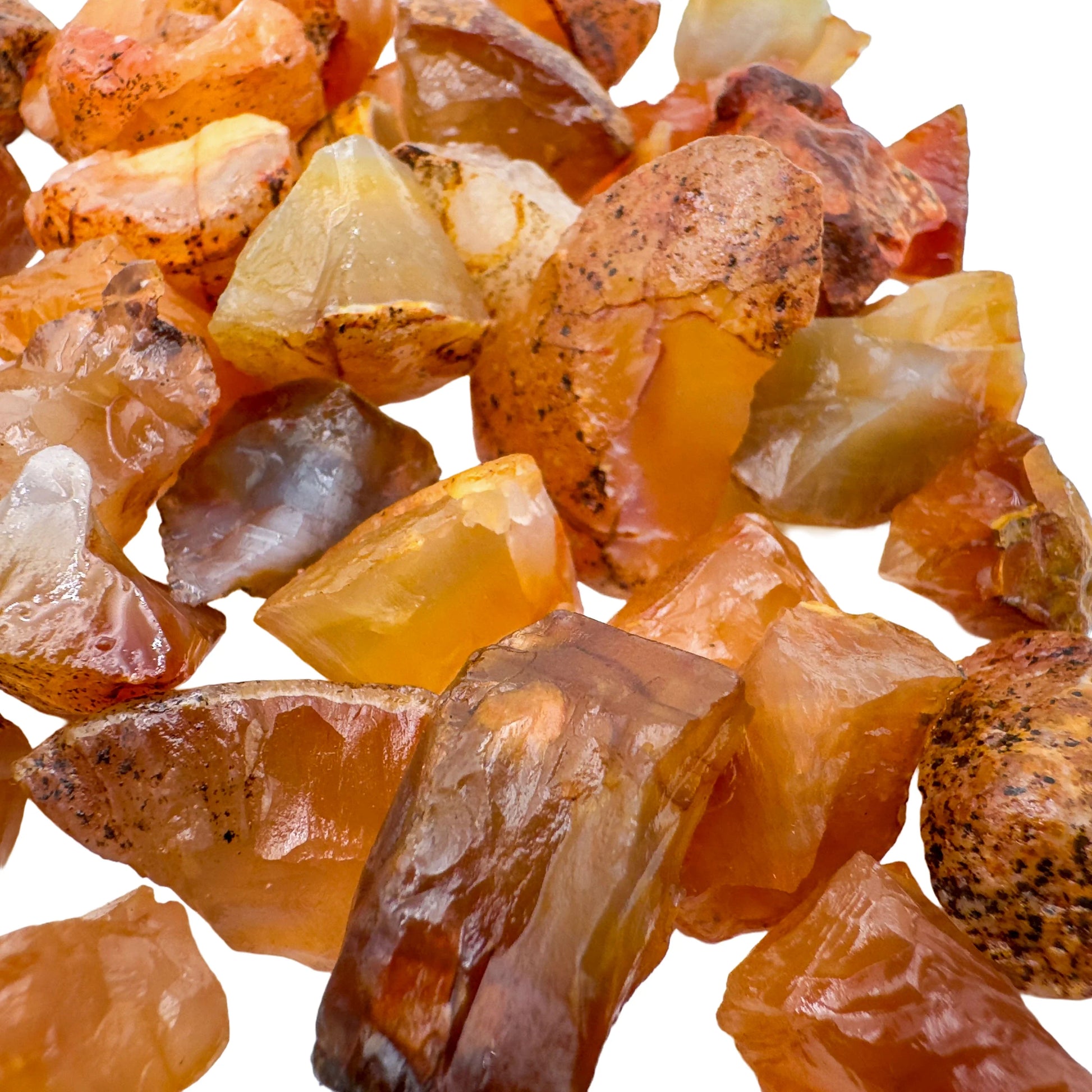 Bottom side of Grade A orange Carnelian raw stone, hand-selected from Rio Grande do Sul, Brazil, showing natural inclusions.