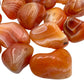 Profile view of Carnelian tumbled stone, kept near for Energy, from Francistown, Botswana.